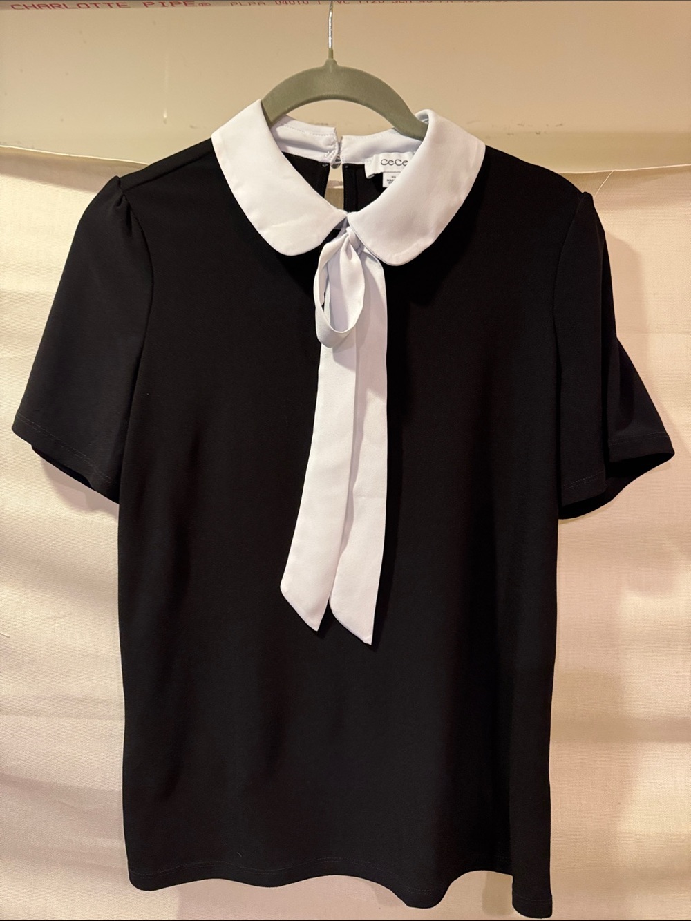 CeCe Black Short Sleeve Top with White Peter Pan Collar and Tie-Front